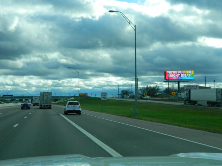 Large commercial billboard along a highway illustrating offline advertising impact.