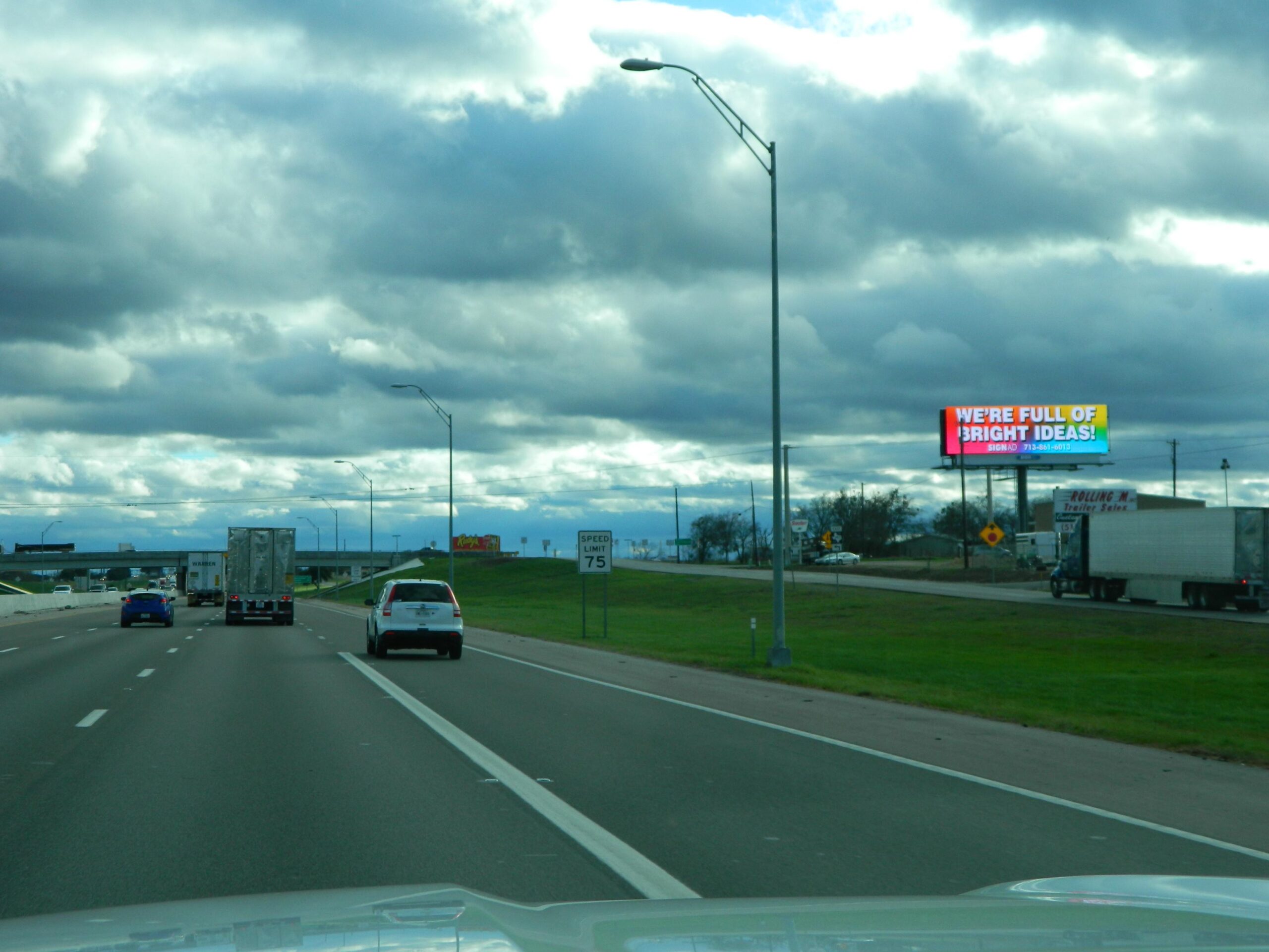 Large commercial billboard along a highway illustrating offline advertising impact.