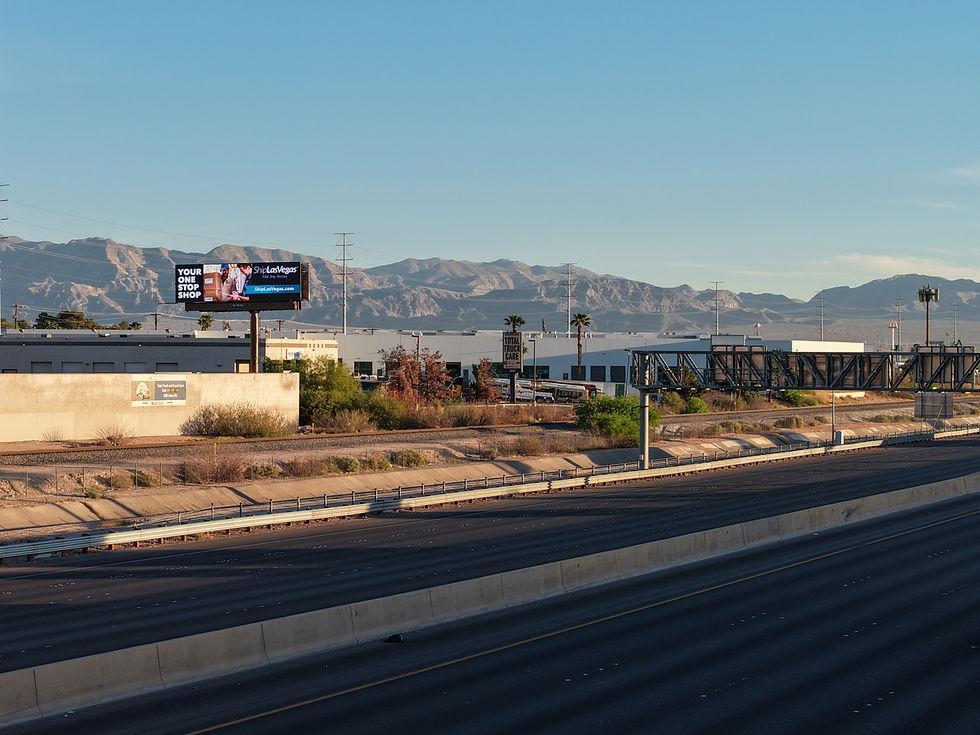 Large outdoor billboard reaching drivers on a busy Las Vegas traffic corridor